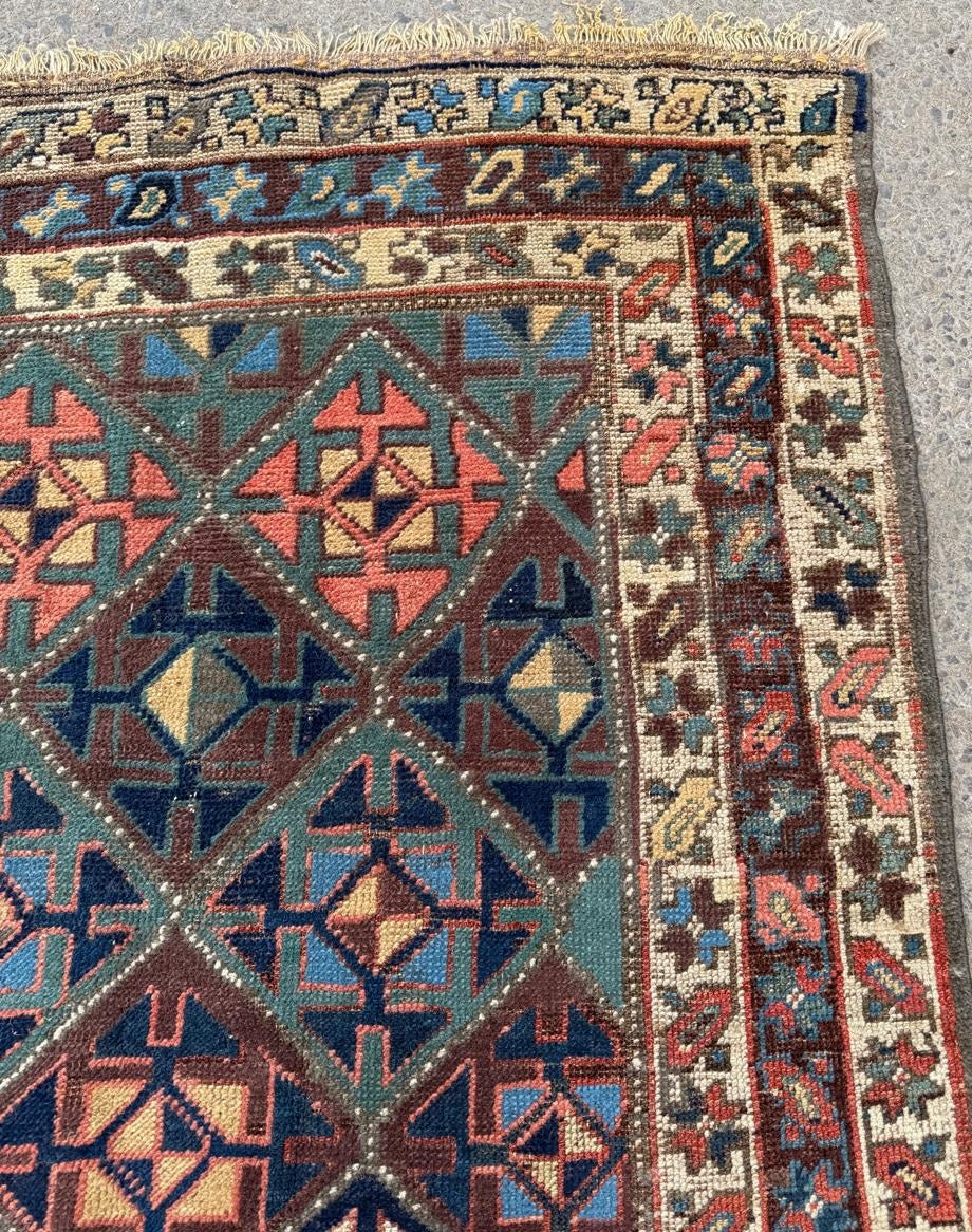 Border floral detail in deep blue and red tones