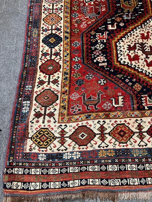 Close-up of bird motif in warm ivory and deep navy