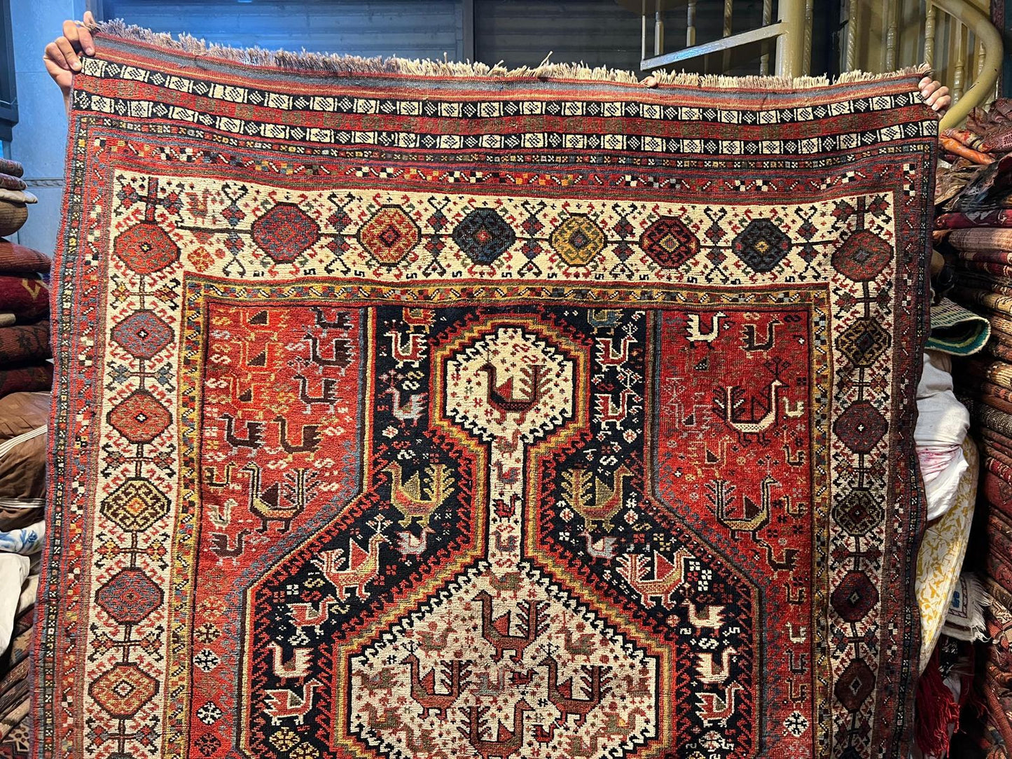 Animal figure motif woven in earthy reds