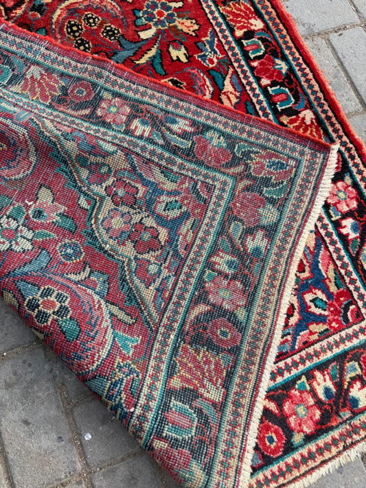 Close-up detail of an elegant floral bouquet and palmette motif.