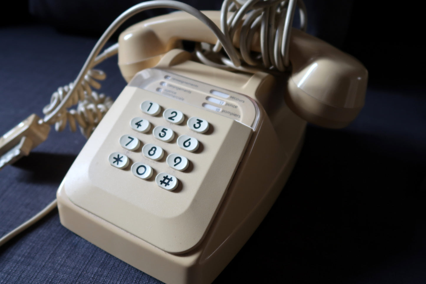 Working vintage house phone with classic beige finish