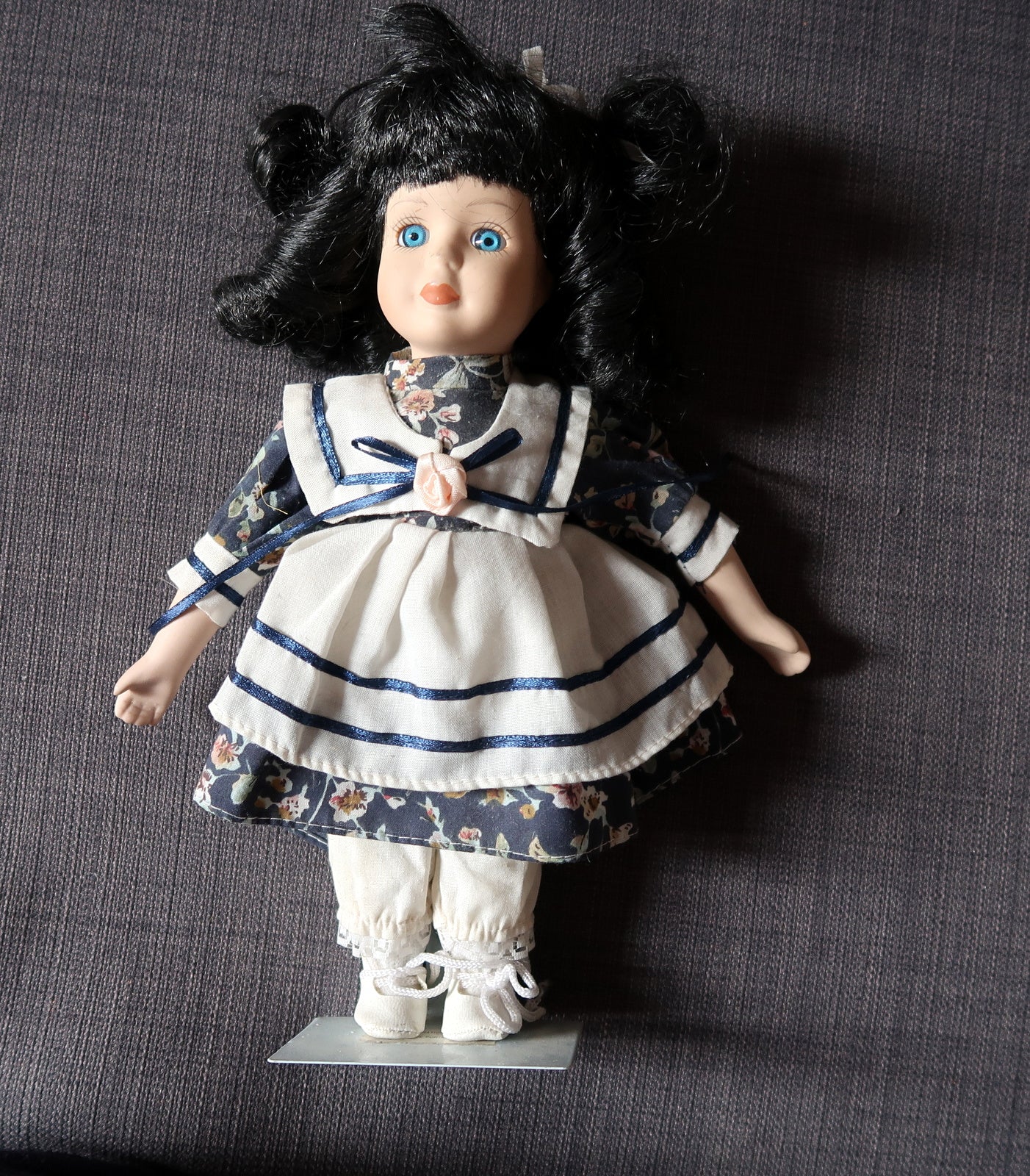 Collectible vintage porcelain doll for display