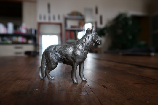 Standing dog with erect ears and separately modelled legs