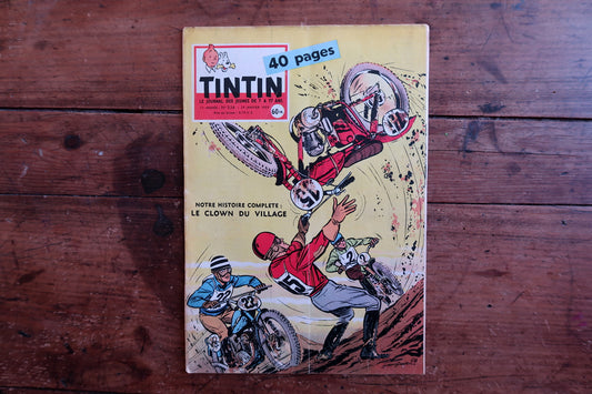 Close-up of the cover art on a 1959 French Tintin comic book magazine showing an action-packed racing scene with motorcycles and riders, with the iconic Tintin header and issue details.