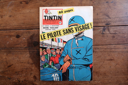 Close-up of the iconic cover art on a 1959 French-Belgian Tintin comic magazine showing Jean Graton's legendary racing character Michel Vaillant, with the headline referencing real-life Formula 1 legend Juan Manuel Fangio.
