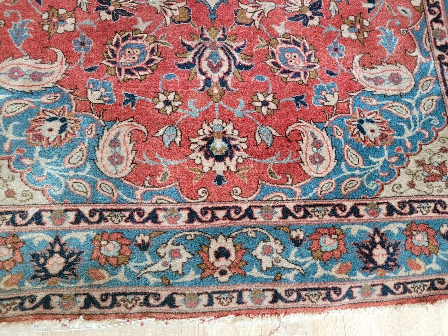 Persian Tabriz rug showcasing a harmonious blend of warm colors