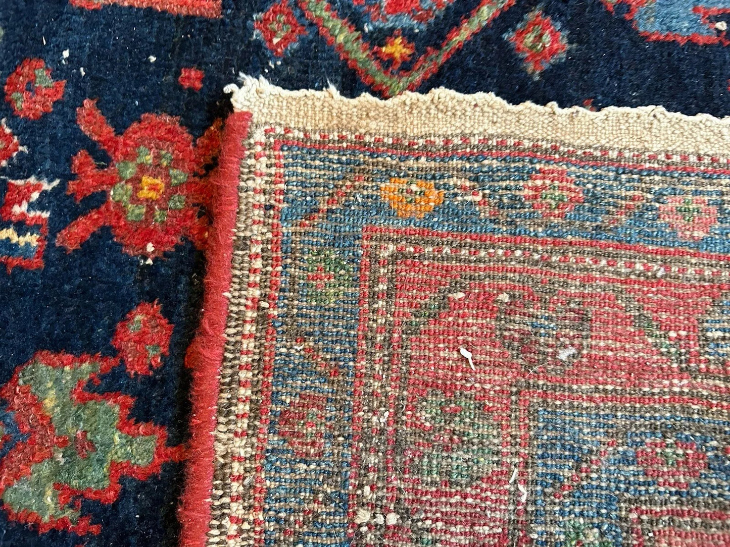 Antique Persian rug with striking tribal arrangements and borders