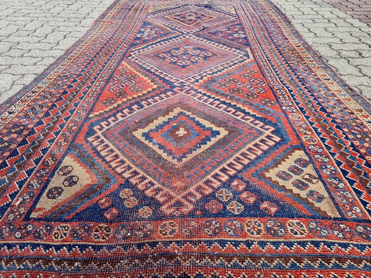 Traditional tribal patterns on Persian handwoven rug