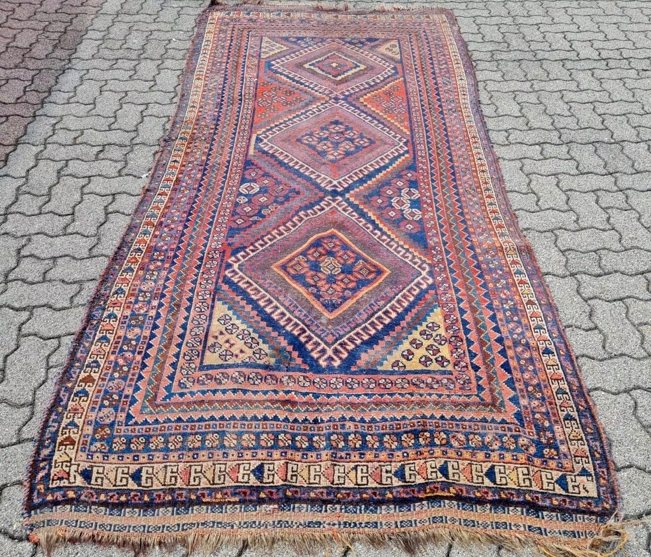 Deep red and navy color palette on Gashkai rug