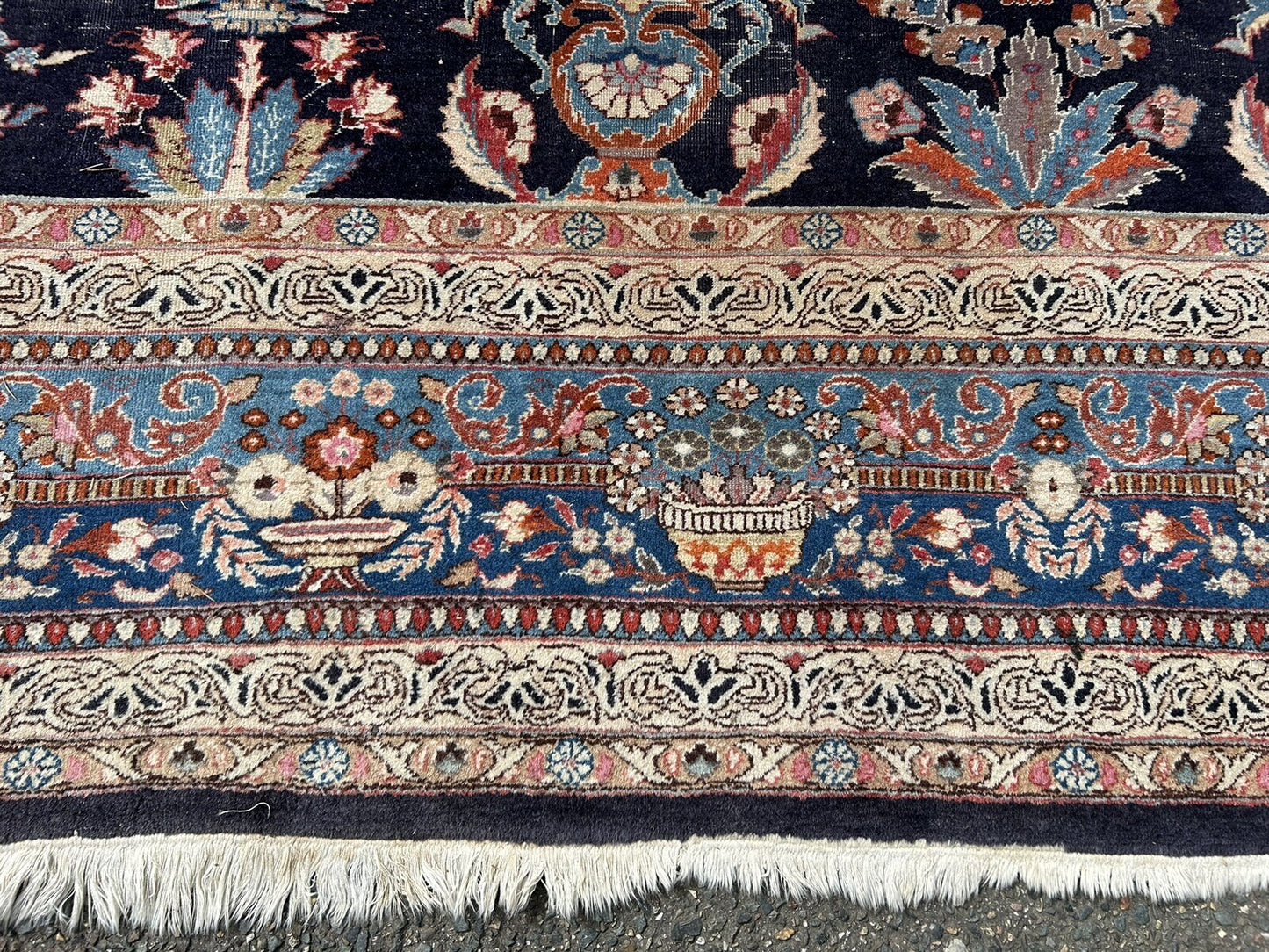 Worn texture showing natural aging of Persian rug