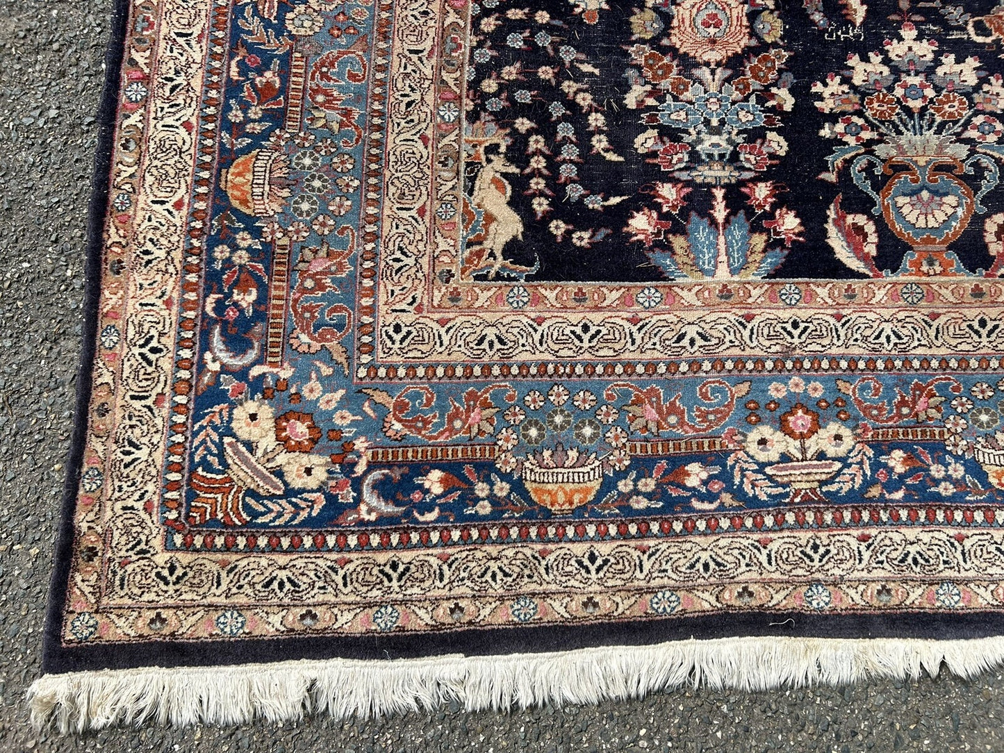 Low pile area on vintage Persian Kashan carpet