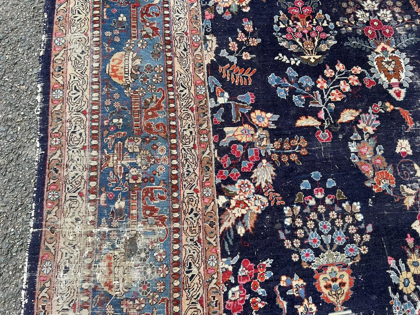 Faded peach and navy accents on Kashan rug