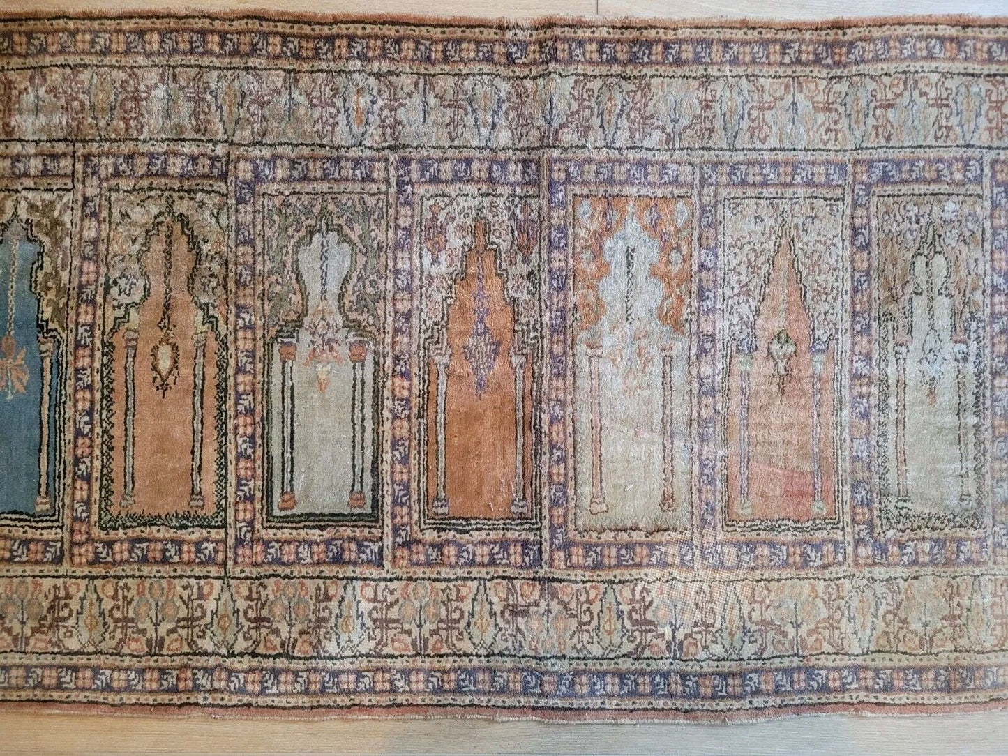 Worn silk prayer rug with subtle vintage wear