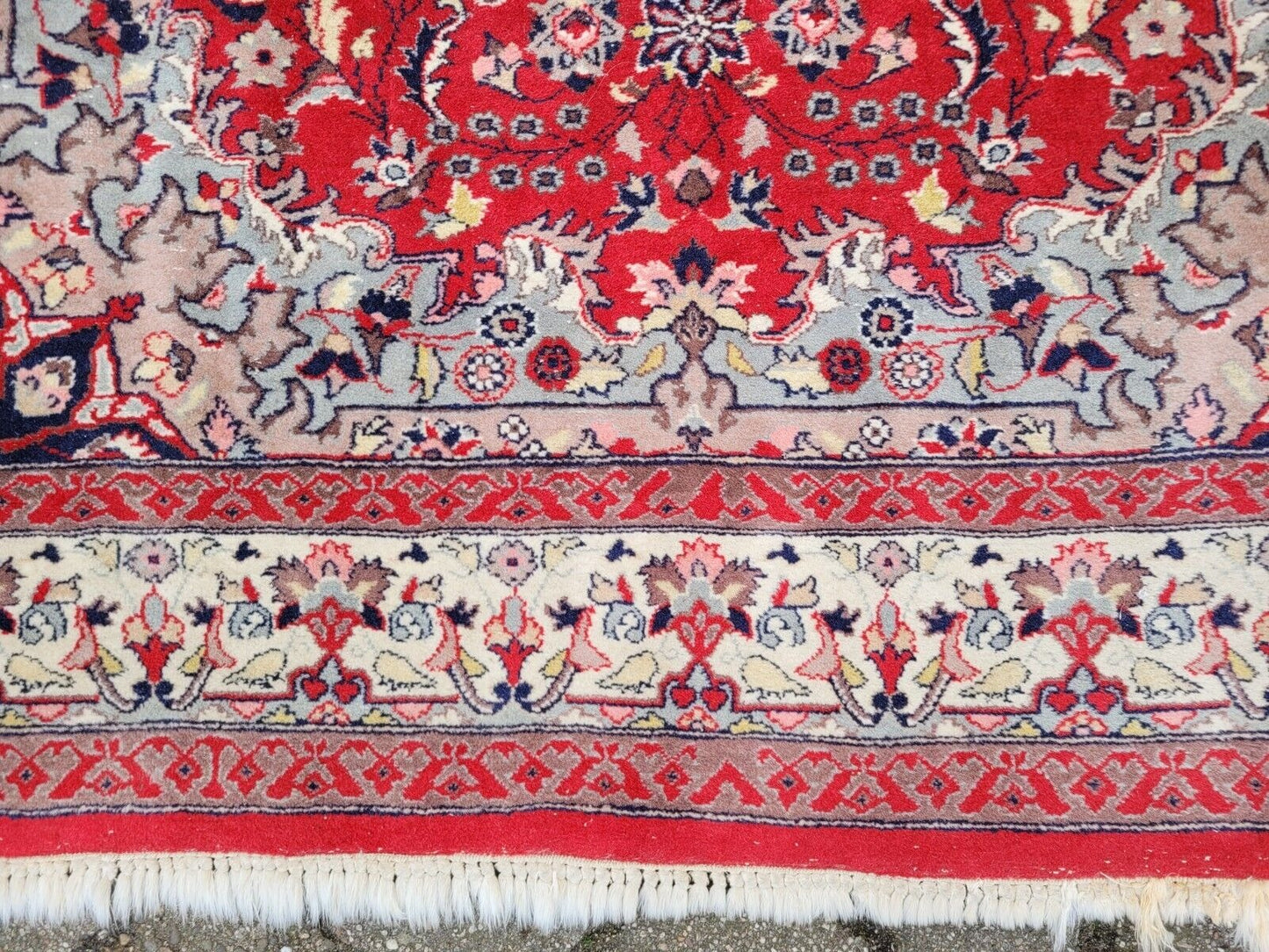 Handmade Sarouk rug with a balanced and symmetrical design.