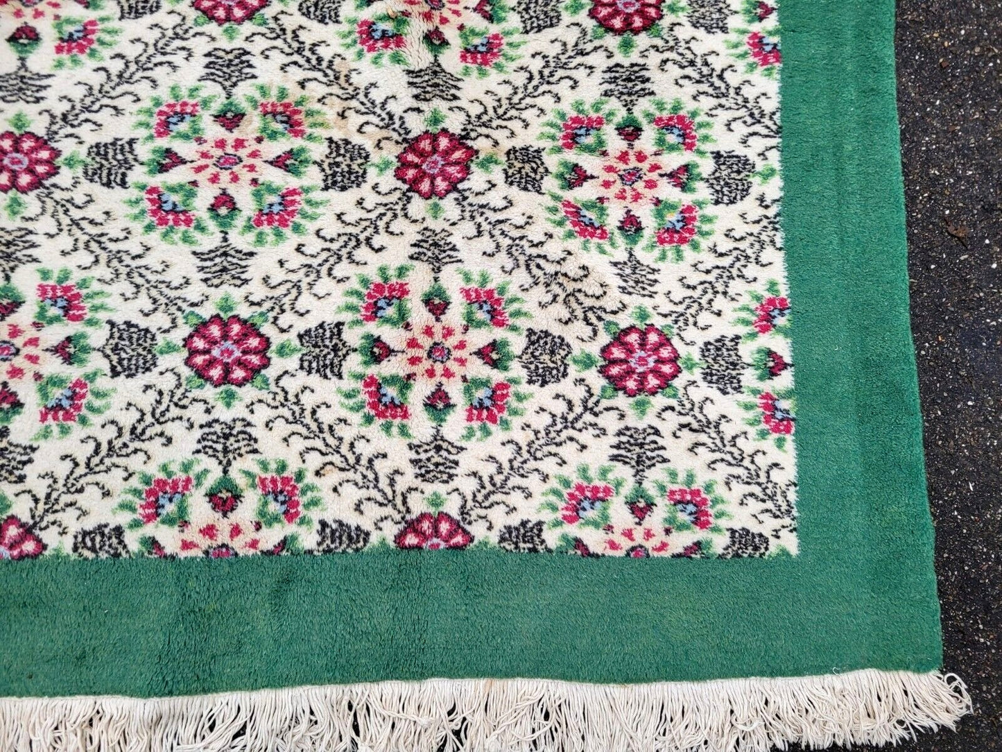 Turkish rug with a harmonious blend of ivory, green, rose, and magenta.