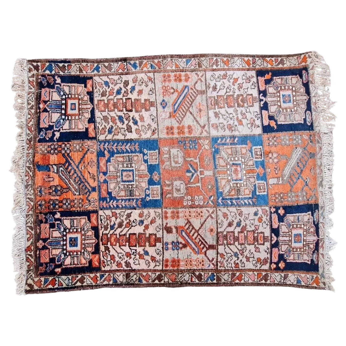 Handmade vintage Persian Bakhtiari rug with a garden panel design.