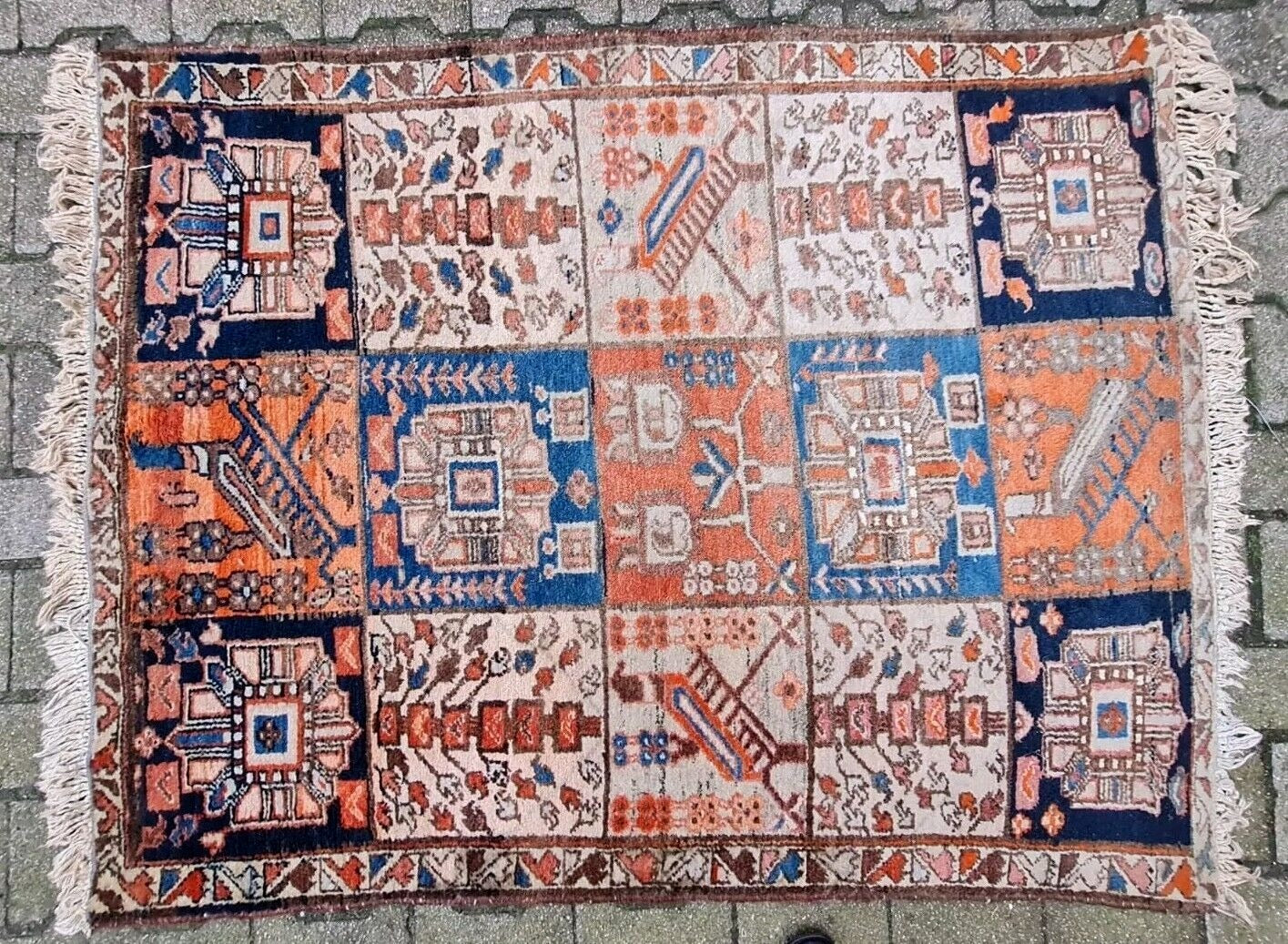 Antique Bakhtiari rug with a highly structured format.
