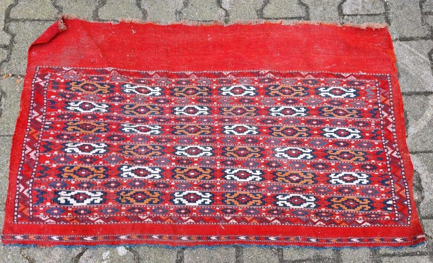 Overhead view of a collectible Central Asian tribal rug.