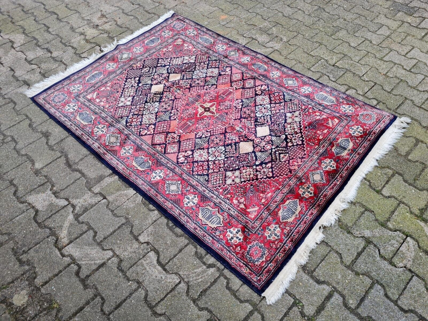 Vintage Kashan rug with a rich red palette and elegant arabesques.