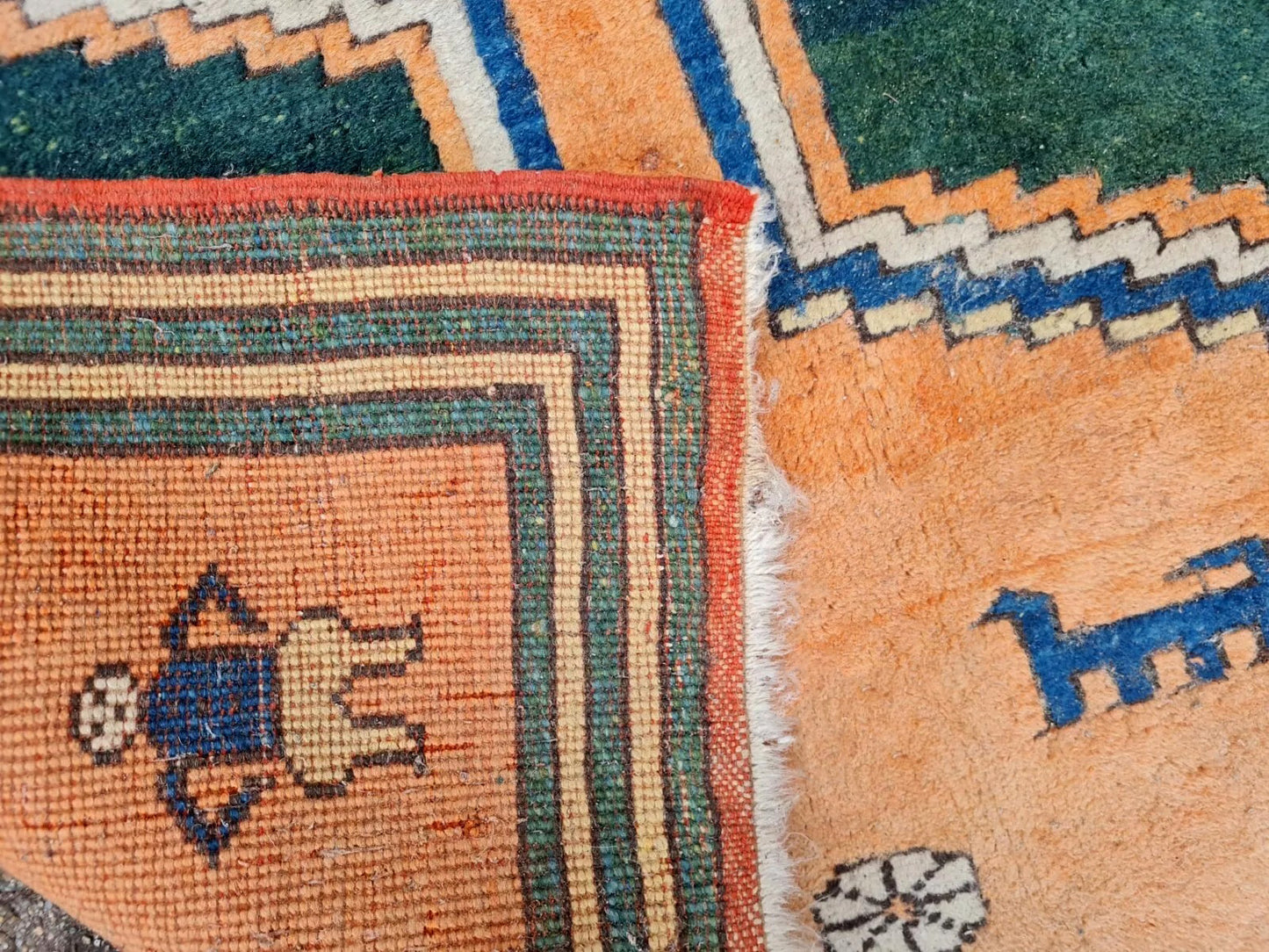 Gabbeh rug with stylized tree and animal figures