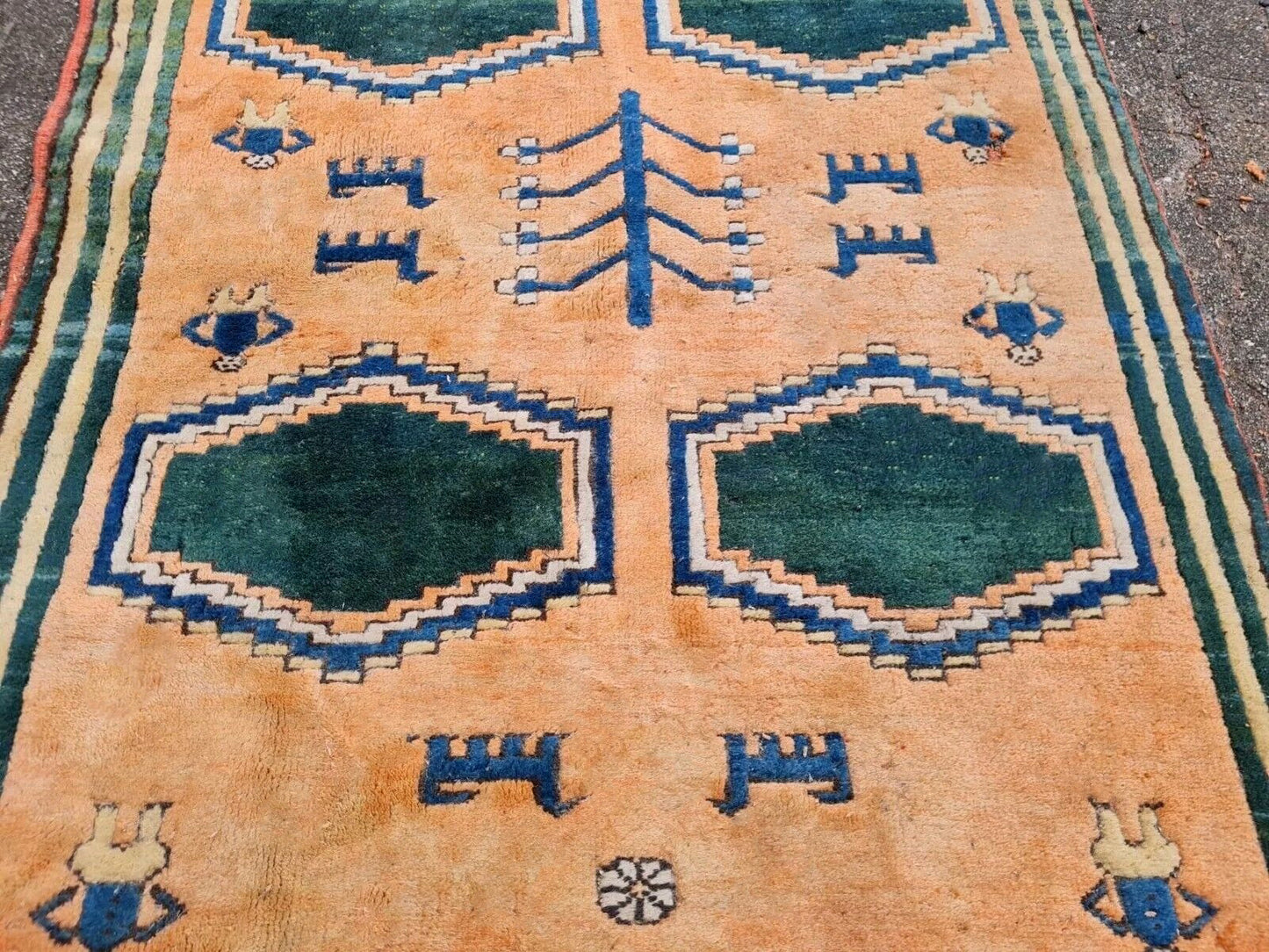 Octagonal blue and teal shapes on orange field