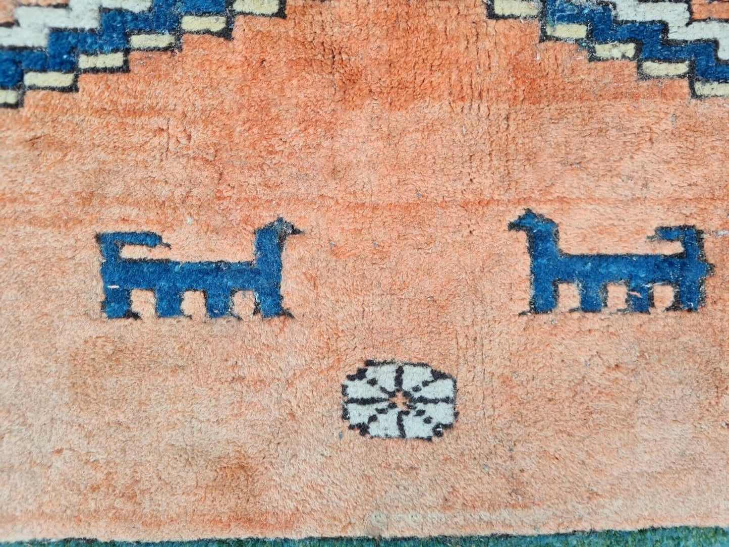 Rustic Gabbeh rug corner with striped borders