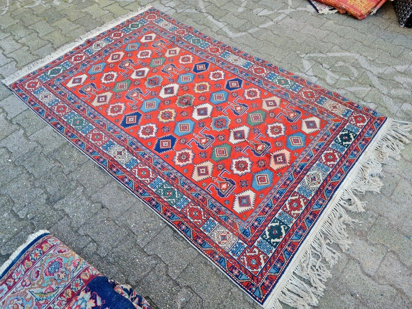 hand-knotted wool texture on 1980s Kazak rug