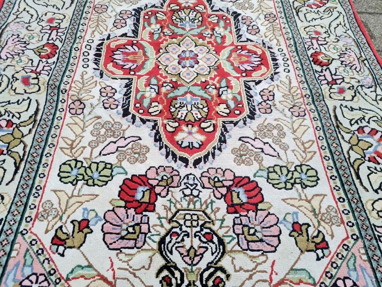 Full view of handmade Persian Kazvin rug with intricate curvilinear design