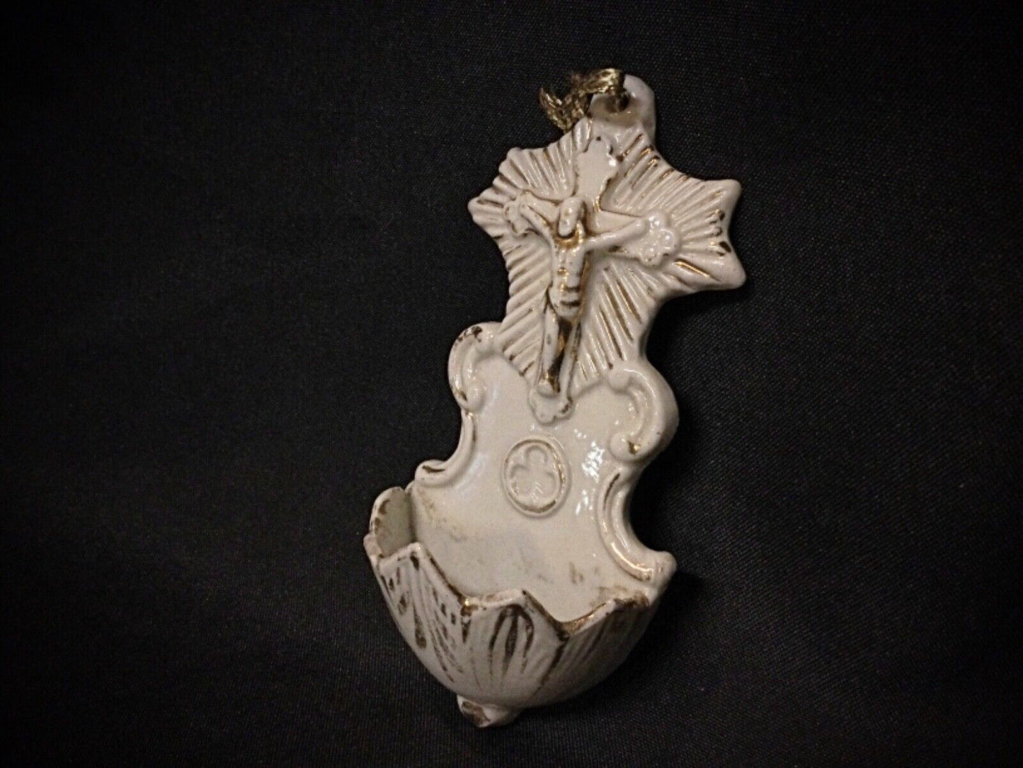 Side view of porcelain Christ wall piece showing depth and dimensions.