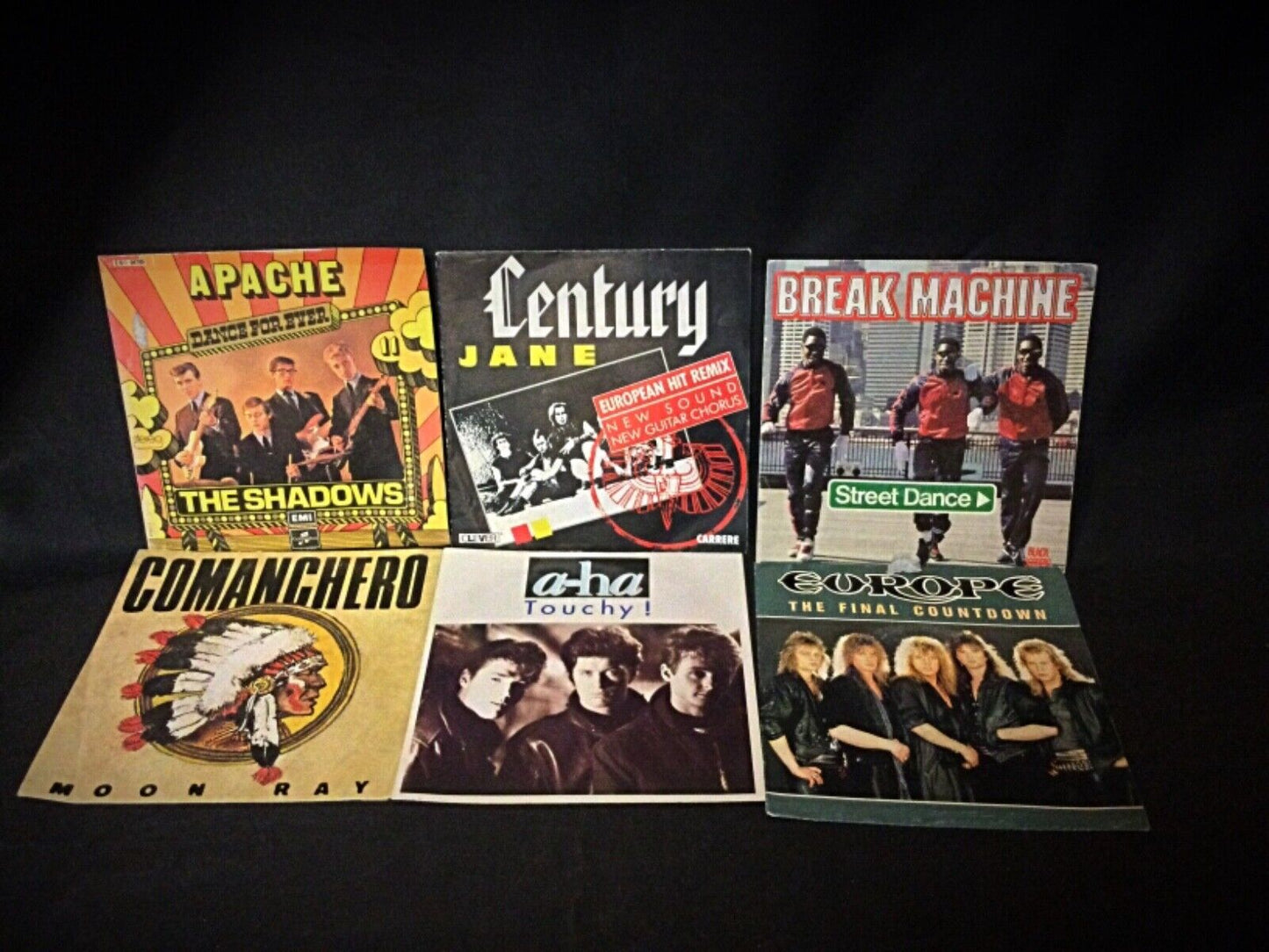 Close-up of the covers of the vintage vinyl records included in the lot.