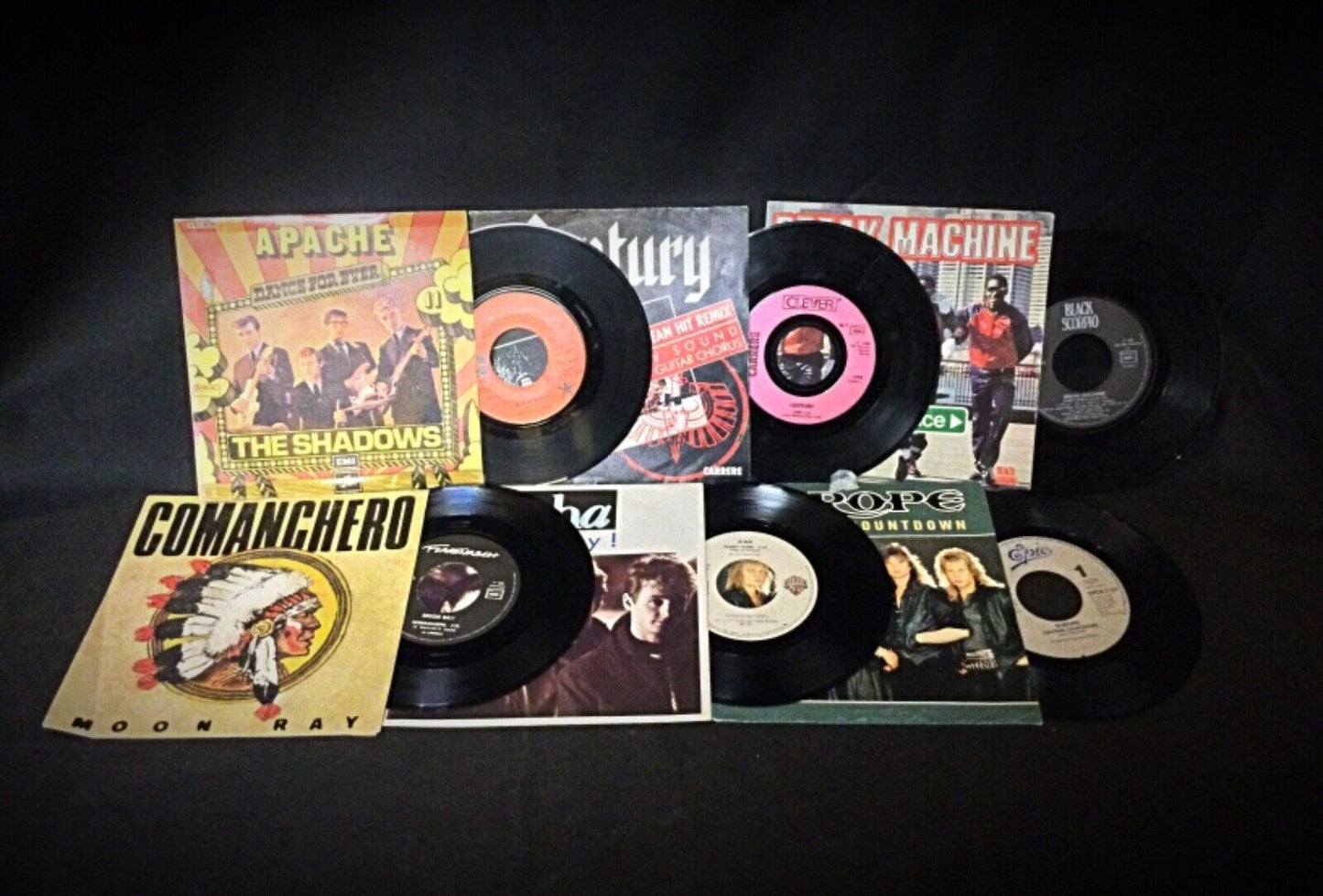Overview of the six 45 RPM vinyl records showcasing different genres.