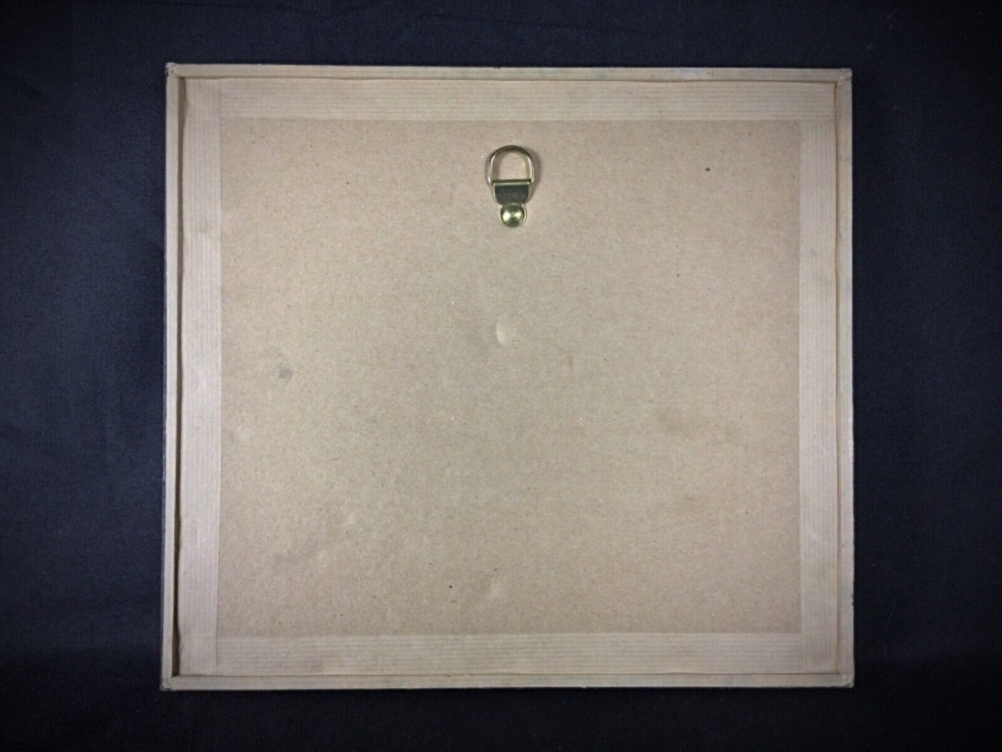 Antique artwork in frame, showing signs of age and vintage charm