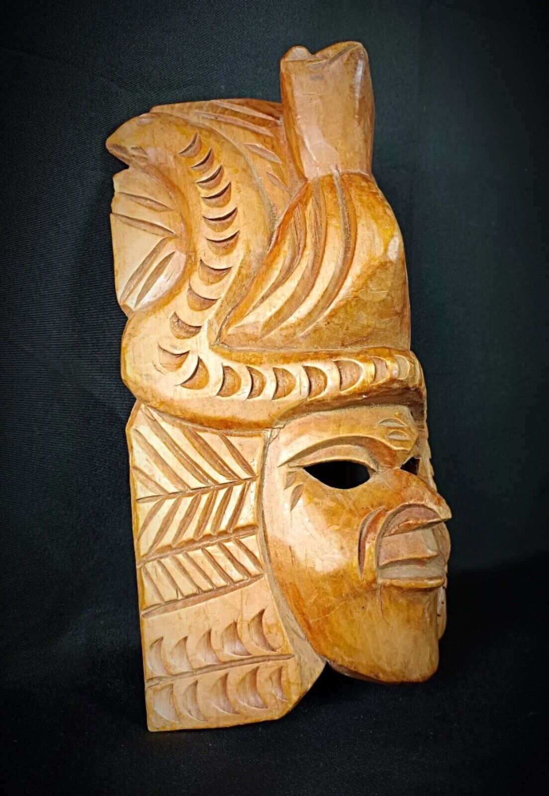 Intricate detailing on an Indigenous American wooden mask