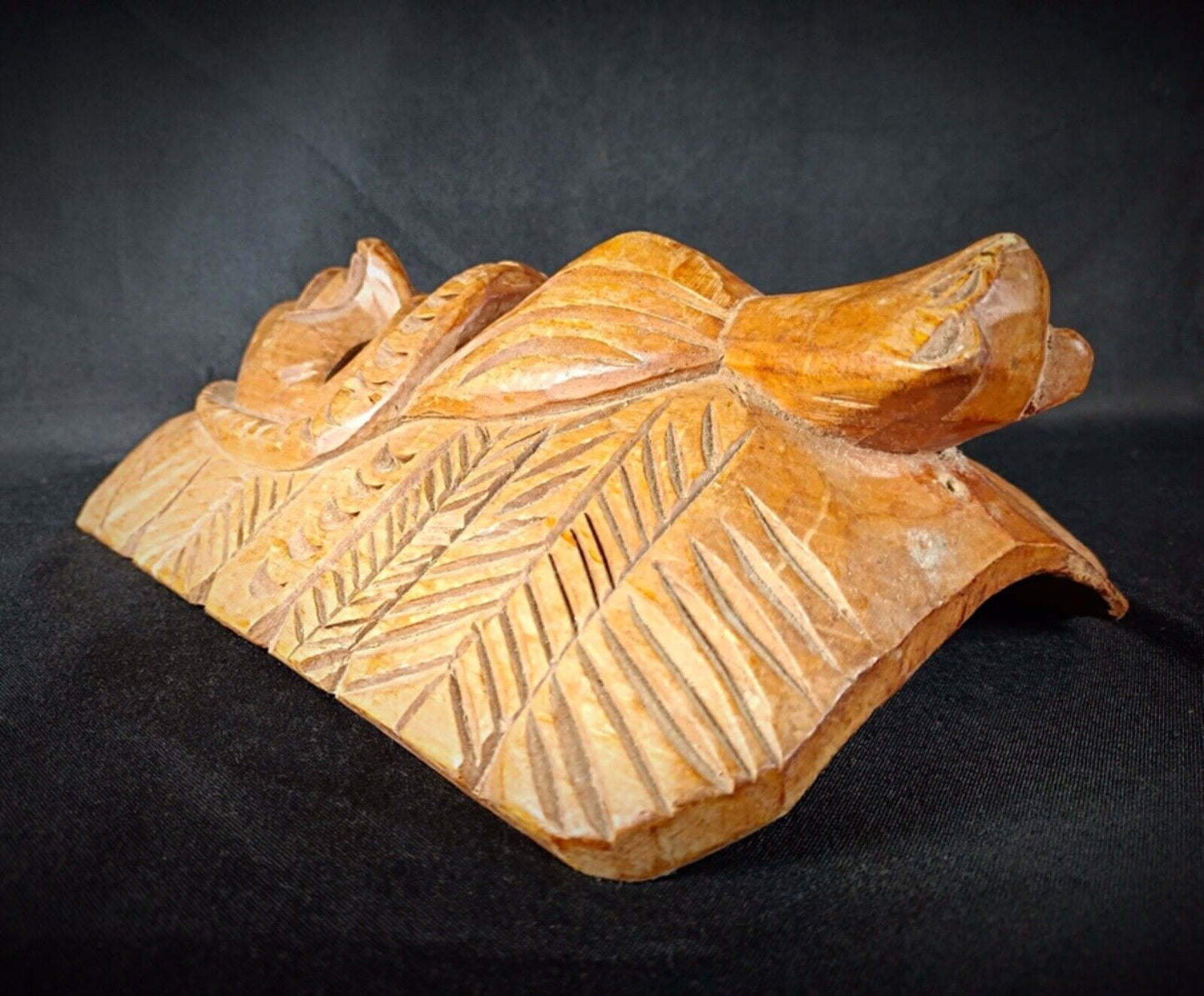 Traditional tribal art: a hand-carved wooden Maya mask