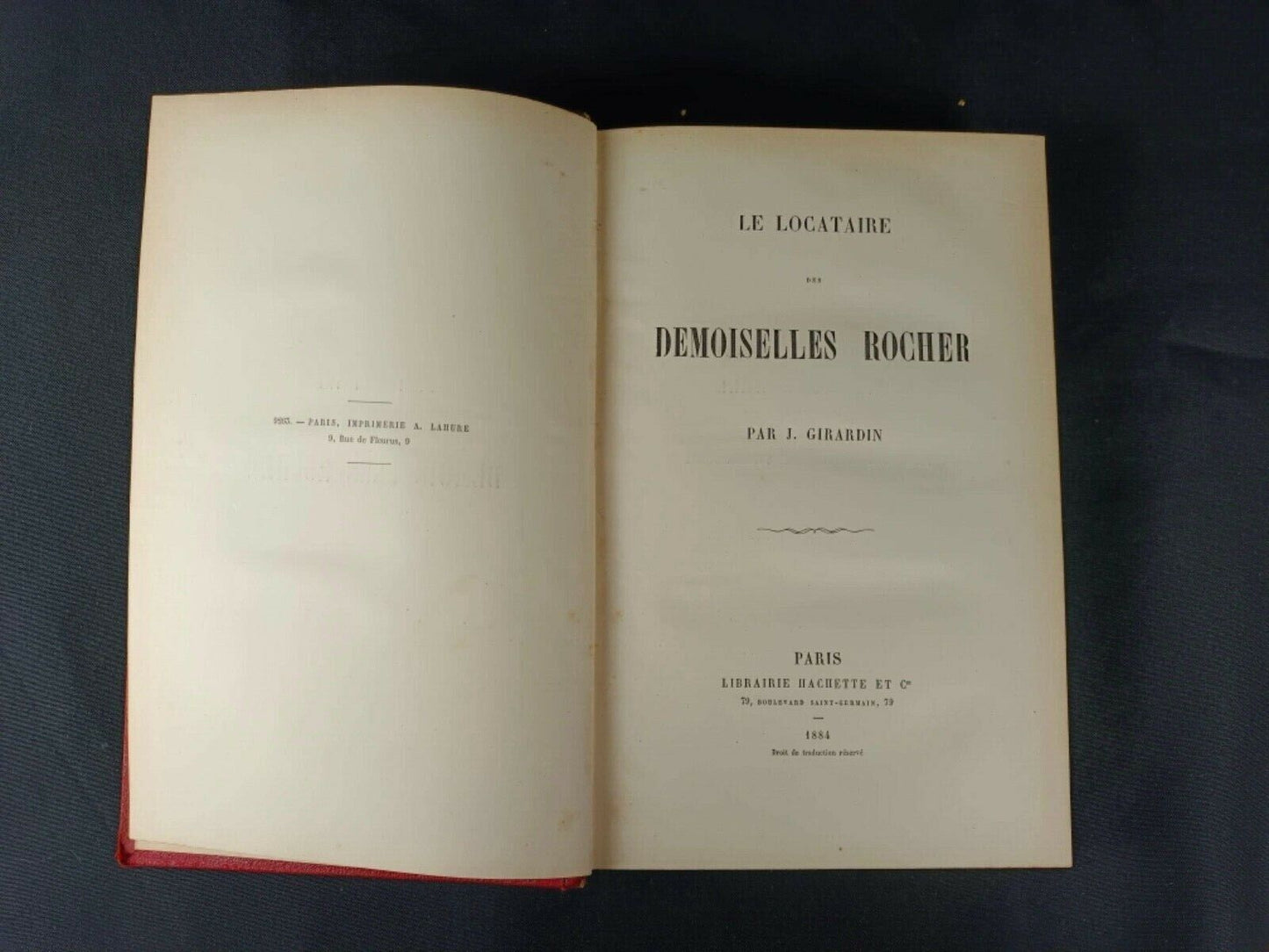 Vintage French novel with an aged cover and yellowed pages