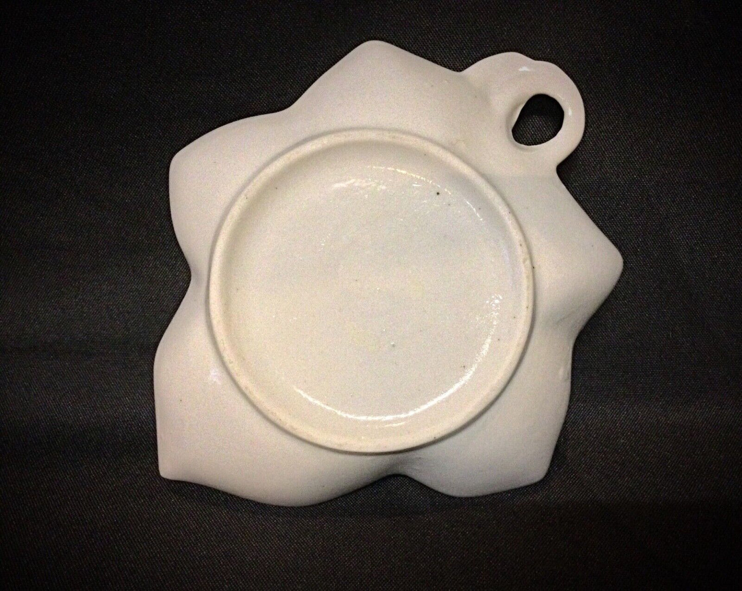 Small ceramic rose paperweight or trinket dish, enhancing any space with its refined design.