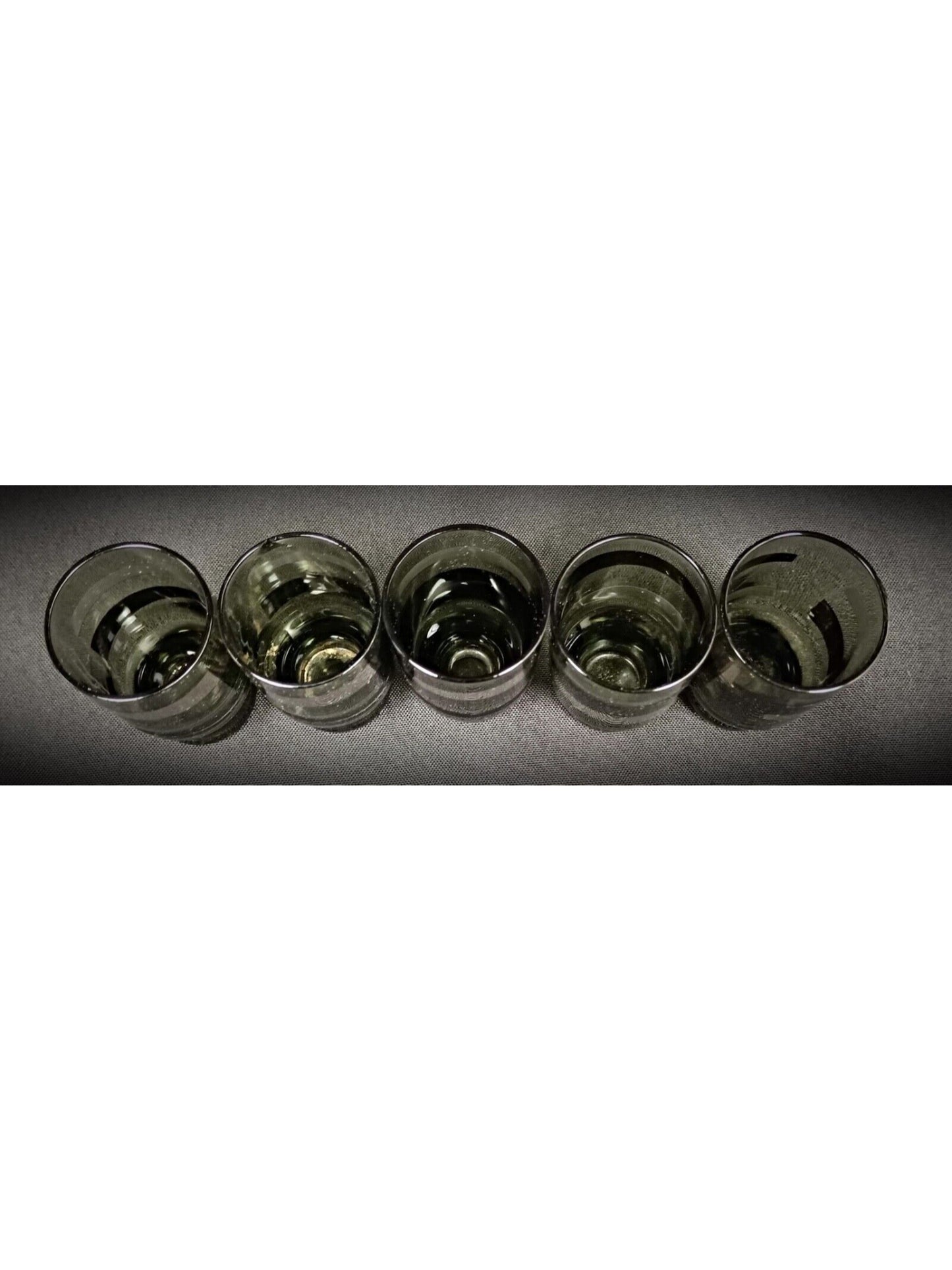 Thin stem and small round base of green liqueur glass