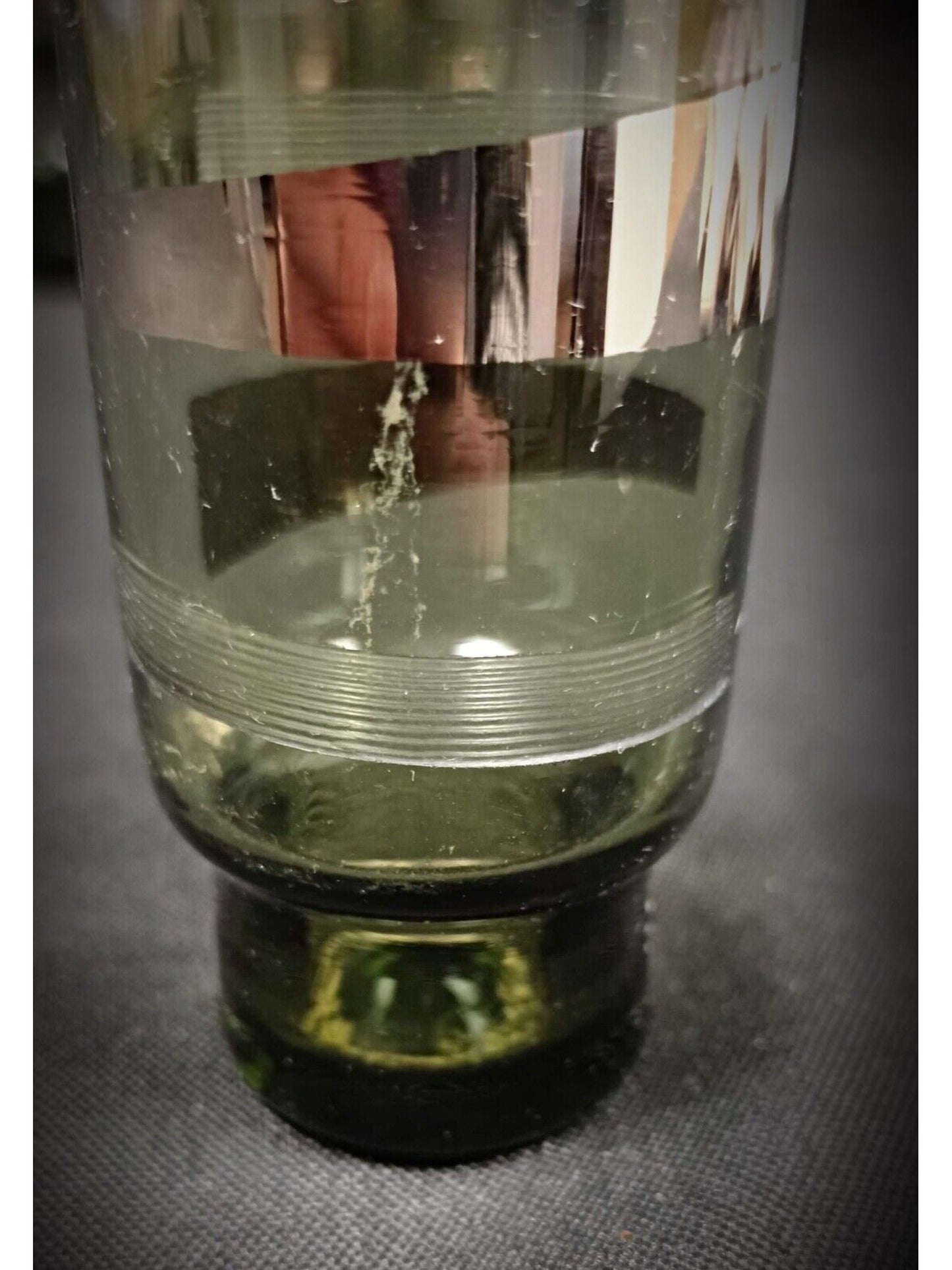 Set of five green crystal glasses arranged elegantly