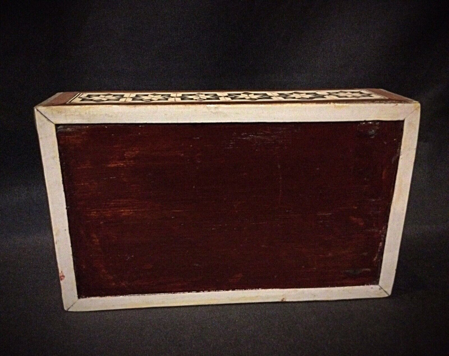 Close-up of the wood marquetry on the antique Syrian jewelry box’s exterior.
