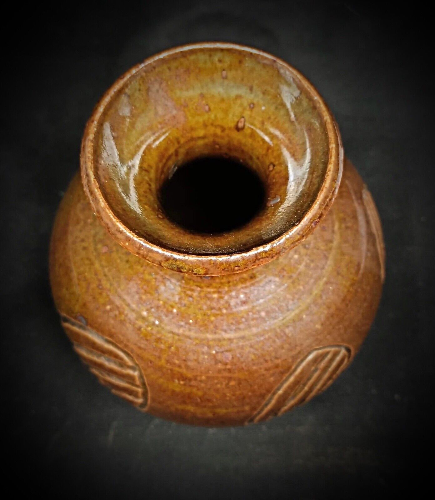 Side view highlighting the hand-formed vase shape