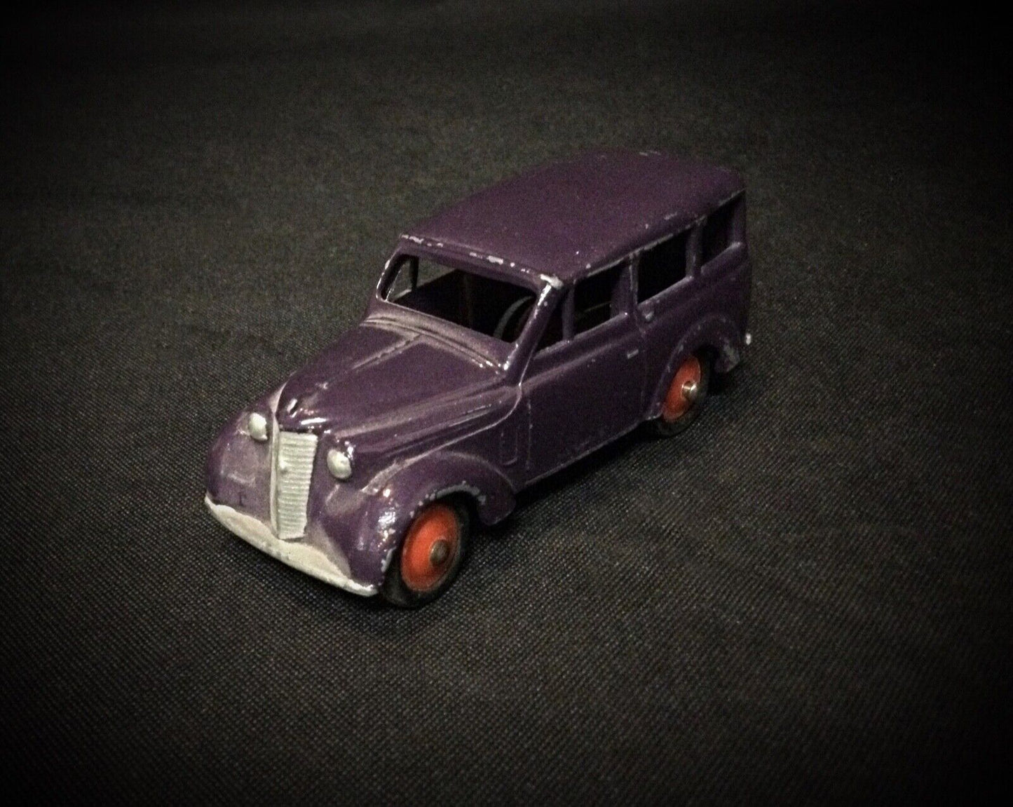 Close-up of the C.I.J logo on the toy car