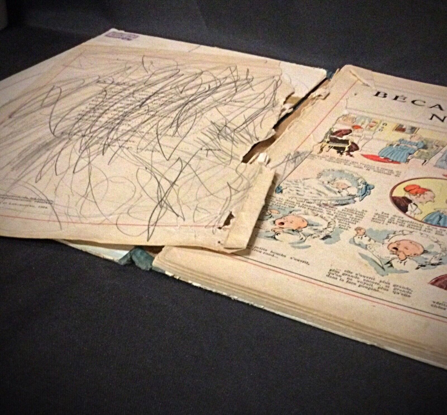 Close-up of stained cover on BĂ©cassine Nourrice, 1924 edition.