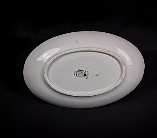 Close-up detail of the hand-painted floral motif on the ceramic