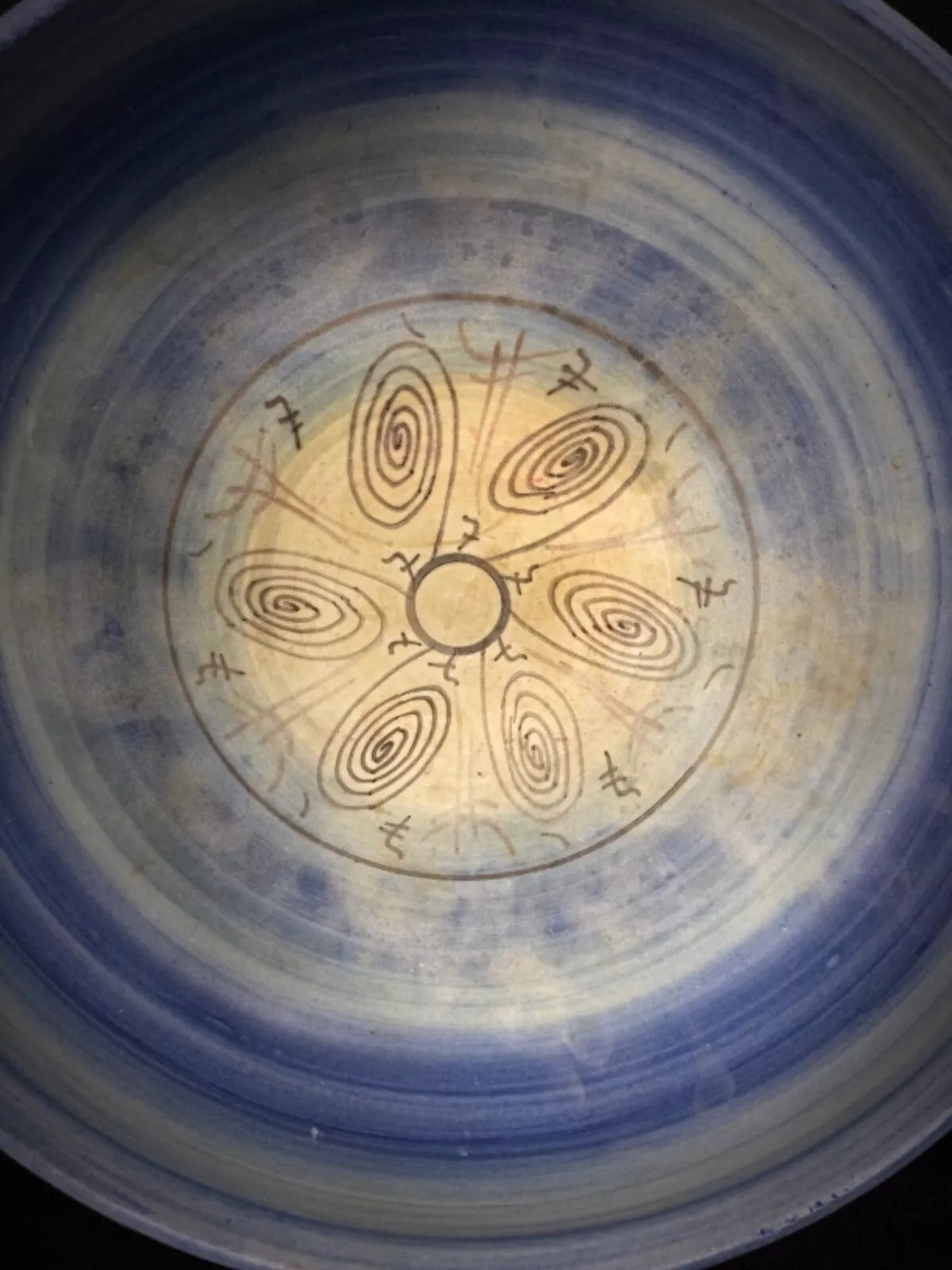 Close-up on the contrast between the amber honey and deep brown glazes.