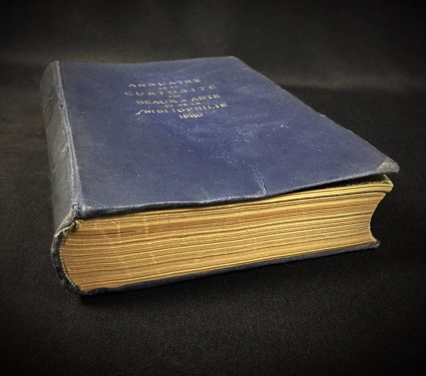 Angle shot capturing the book's substantial presence on a desk.