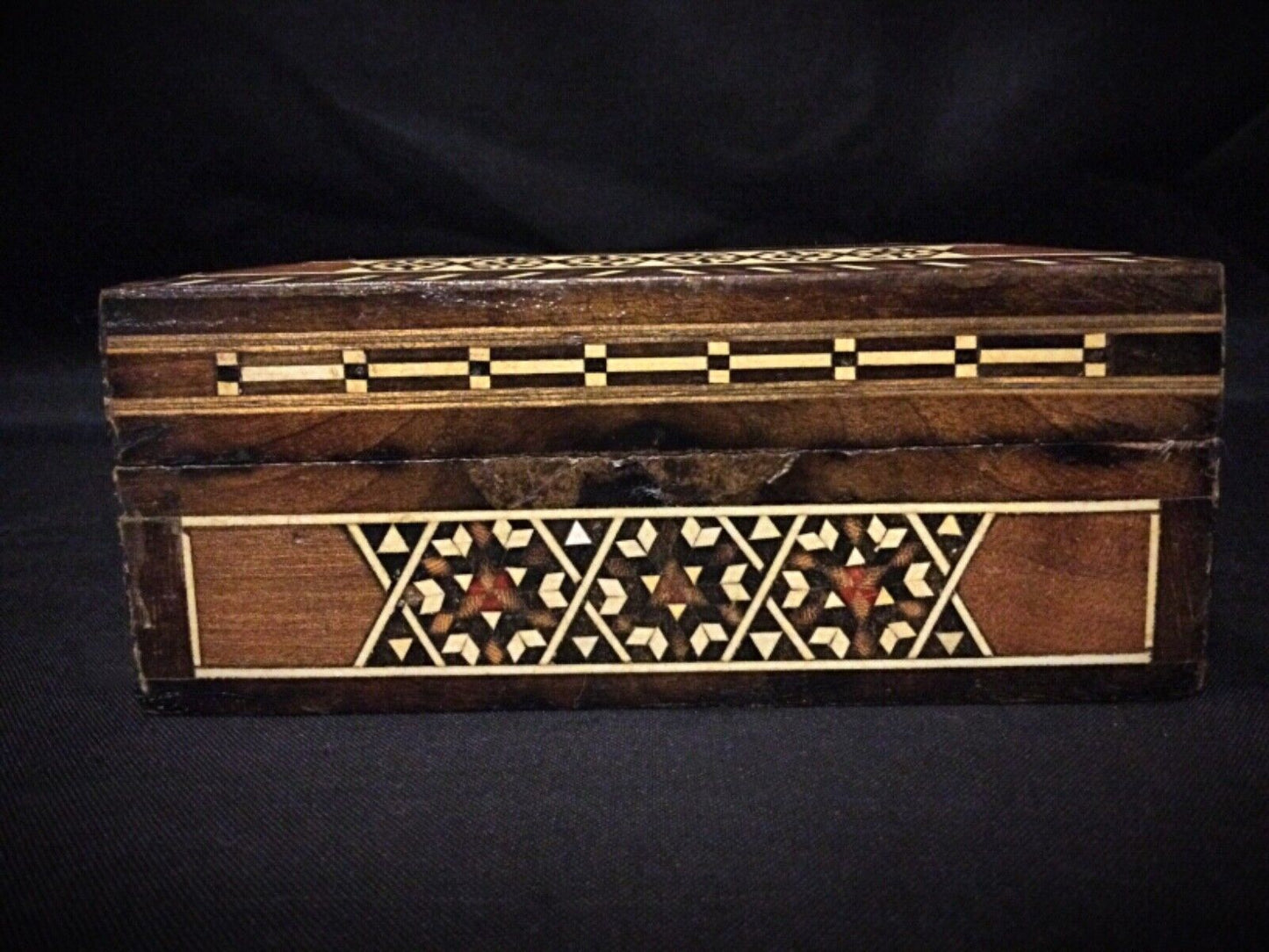 Detailed close-up of the marquetry pattern on the box’s surface.