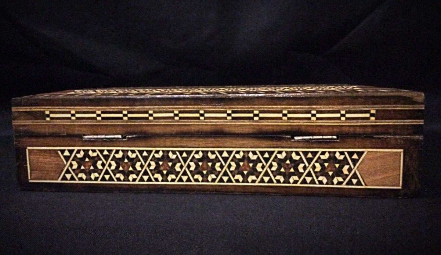 Interior shot of the box with jewelry placed inside for scale.