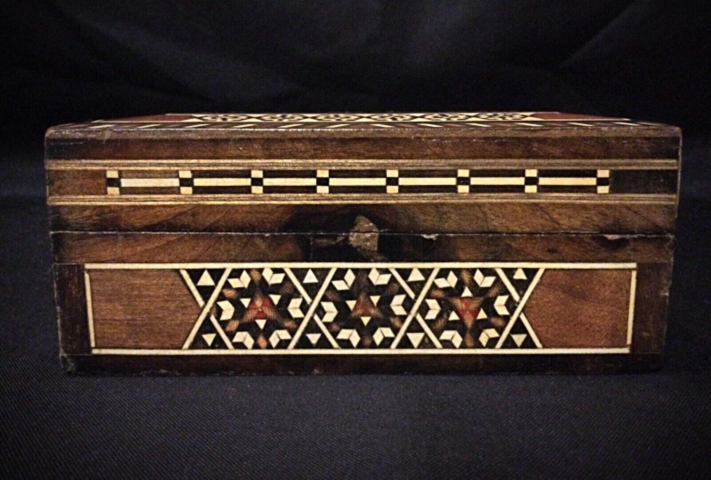 The jewelry box displayed on a tabletop as a decorative accent piece.