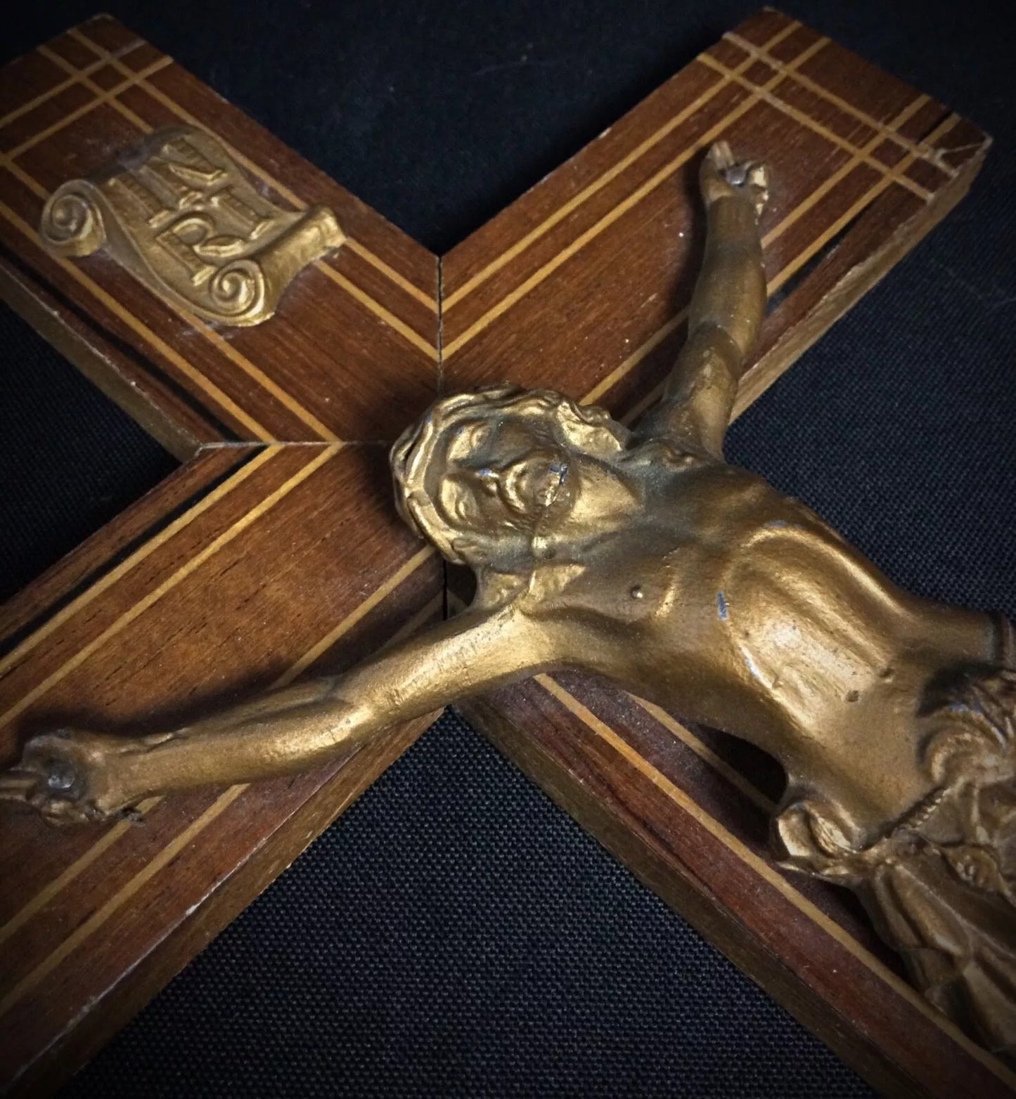 Detail of wooden cross arms and corpus attachment on late 20th century religious piece