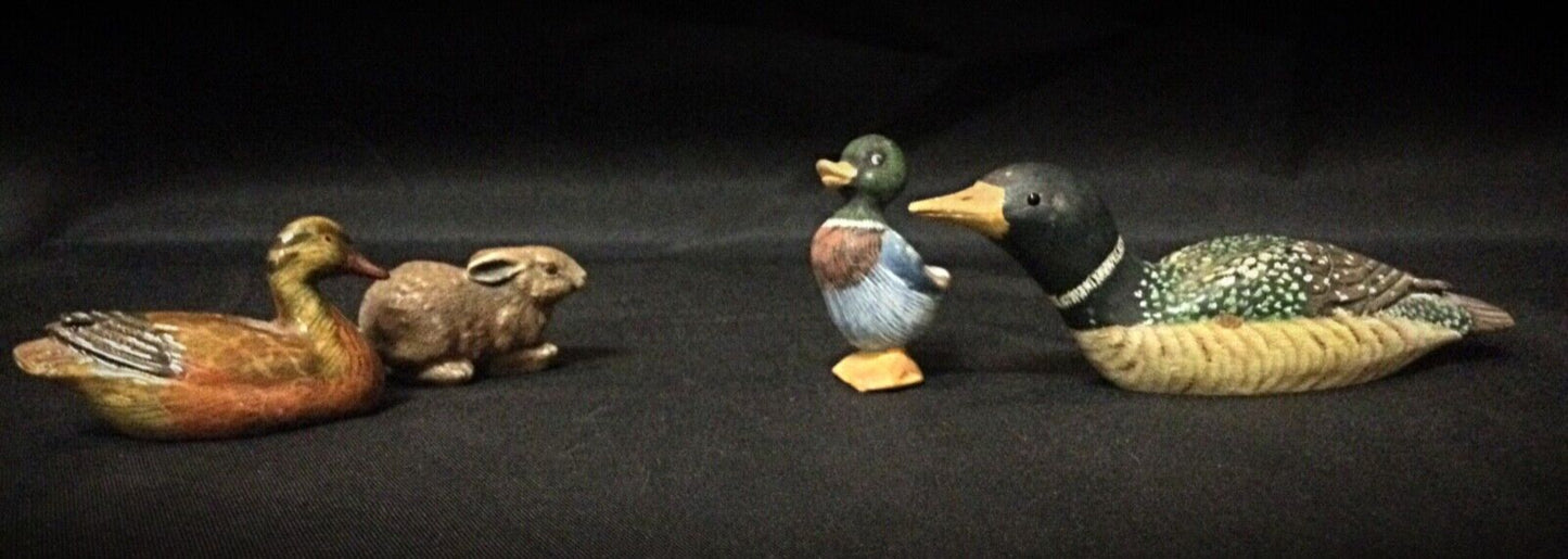 The full set of four animal figurines, arranged for display